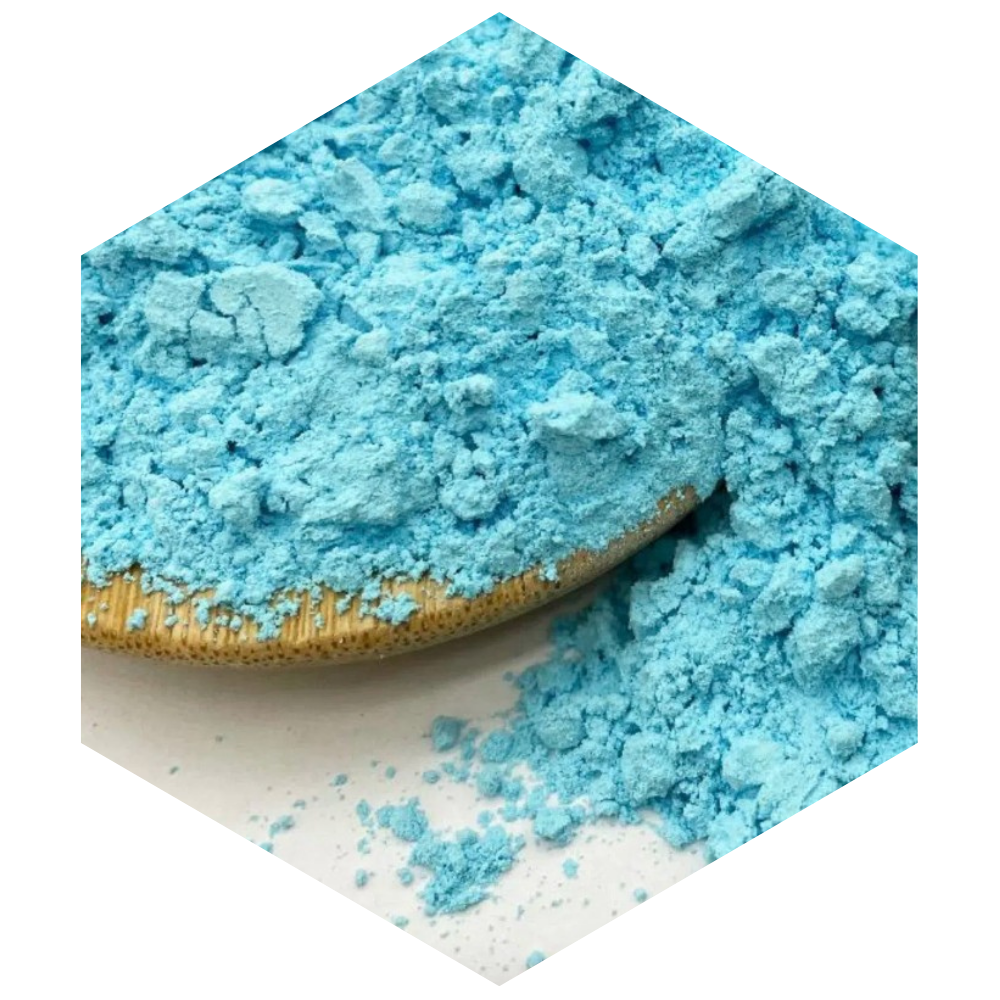 Blue powder in a hexagonal container on a white background