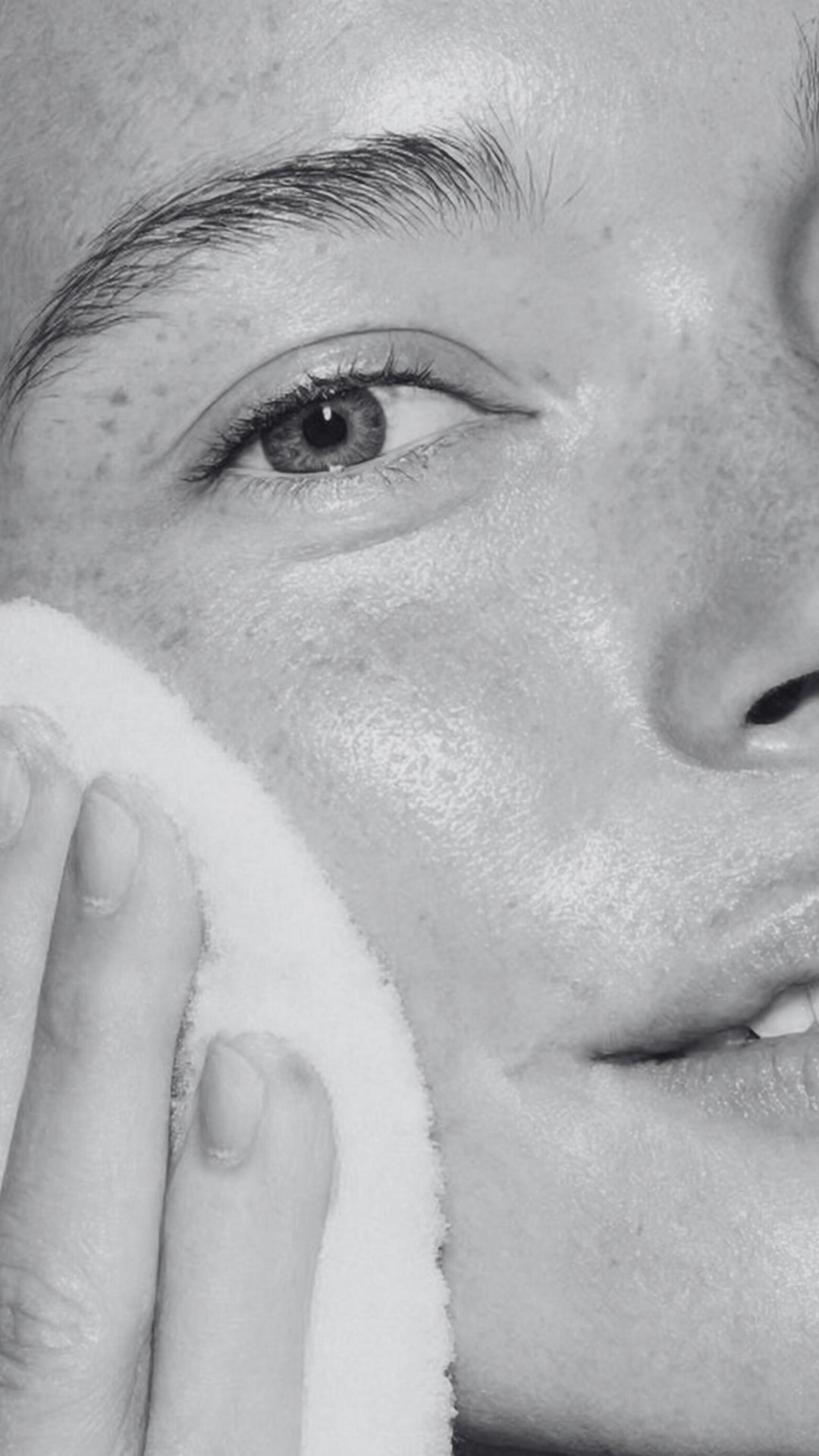 Close-up of a person's eye with a towel held close to the face